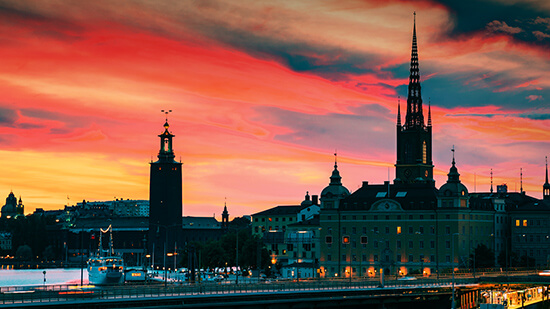 Stockholm city hall and old town skyline at sunset